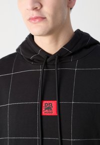 HUGO DALLY - Sweat à capuche - black