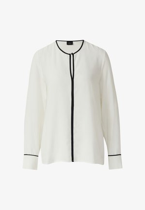 Valkoinen pitkähihainen paita, jossa on pyöreä kaula-aukko, musta trimmi ja napittomasti suljettu etupaneeli. Silkkinen kangas, jossa on hihansuun tikkaukset.