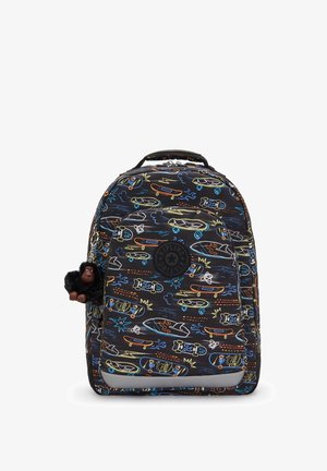 Musta kangaskassi, jossa on värikkäitä skeittilautoja ja aaltojen kuvioita. Kassin päällä on pörröinen gorillan avaimenperä ja logopatchi edessä.