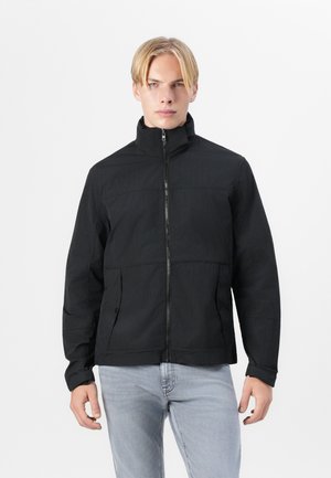 Black jacket with a high collar, front zipper, and two side pockets. Fabric has a smooth texture with subtle patterns.