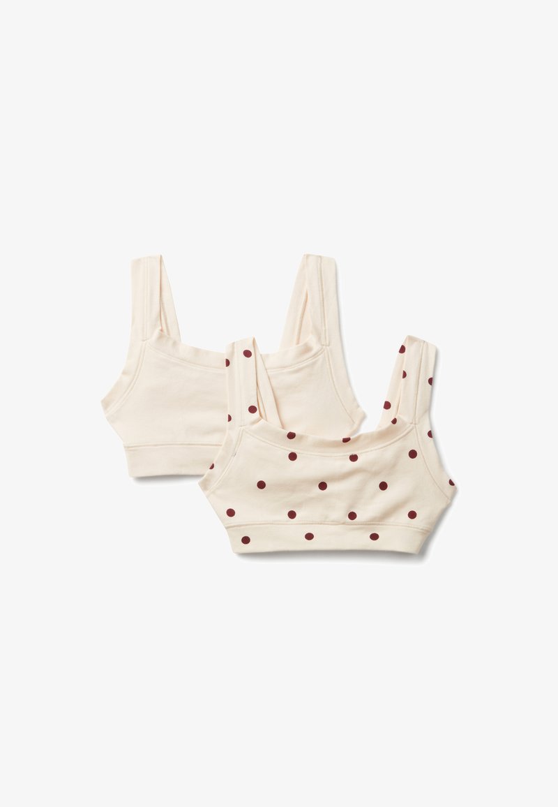 Due bralette in cotone color crema, una semplice e l'altra con pois bordeaux, disposte su uno sfondo bianco.