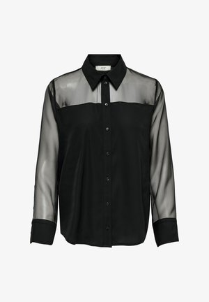 Crna bluzica s kragnom, koja ima prozirne rukave i čvrsto tijelo. Dugmad duž prednje strane, glatka tekstura tkanine.