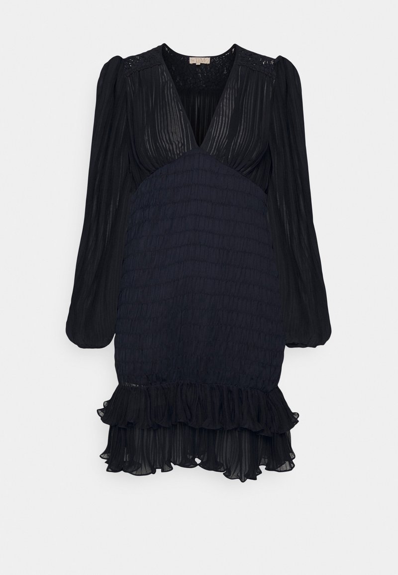 Black dress with long sleeves, pleated texture, V-neckline, smocked waist, and ruffled hem. Lightweight fabric with intricate lace accents.