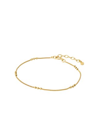 Jemný zlatý náramok s malými okrúhlymi korálkami a nastaviteľnou sponou s očkami na bielom pozadí.