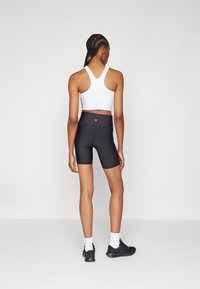 Athleta INTERVAL STASH SHORT - Leggingek - black
