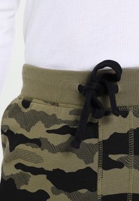 Diesel Teplákové kalhoty - olive