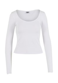 Valkoinen pitkähihainen paita, joka on valmistettu joustavasta kankaasta. Paidassa on pyöristetty pääntie ja kergotettu malli, ilman koristeita tai kuvioita.