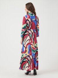 Multicolored long dress featuring abstract patterns in red, green, blue, and yellow. Made of soft fabric with a collared design and side slits.