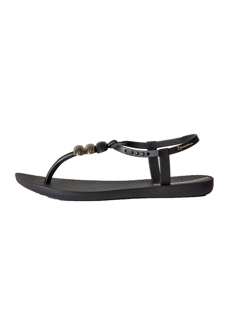 Infradito neri con una soletta testurizzata, un design minimalista delle cinghie e accenti decorativi in perline sulla parte superiore.