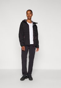 Black insulated jacket with a gray hood, pink zipper accents; paired with black pants and black footwear. Smooth texture, functional design.