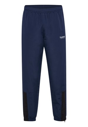 Marineblauwe sportbroek met elastische tailleband, smal toelopende pasvorm, zijzakken en zwarte accenten op de onderbenen. Lichtgewicht, gladde stof.
