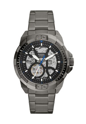 Orologio automatico da uomo Fossil con ingranaggi visibili, quadrante nero, indici delle ore color argento, lancetta dei secondi blu e bracciale in metallo a maglie.