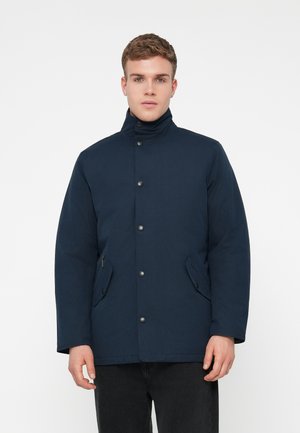 Navy blue jacket with a high collar, snap button closure, two front pockets, and a smooth texture. Designed for warmth.