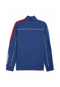 Mørkeblåt sweatshirt med høj krave; har røde, blå og hvide detaljer på skuldrene og ærmerne; logo på venstre ærme.