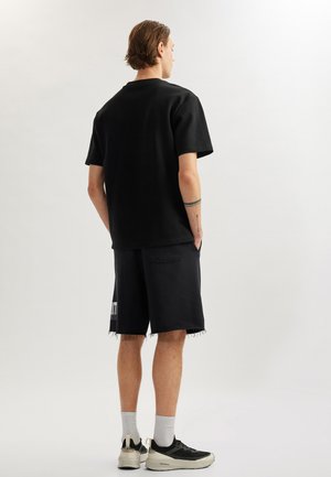 Pantalon de survêtement - black