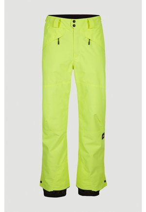 Pantalon de ski imperméable jaune vif avec poches avant à double fermeture éclair, poignets intérieurs noirs et ourlets de jambes réglables avec boutons.