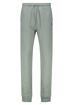 Pantalon de survêtement en coton gris avec taille élastique et cordon de serrage, doté de poches latérales et de jambes fuselées, texture lisse et design minimaliste.