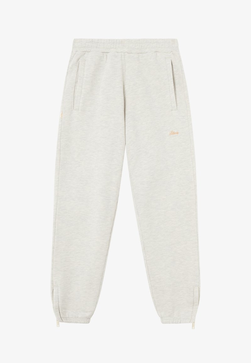 Light grey jogger pants with a soft texture, elastic waistband, side pockets, and zippers at the ankles. Subtle branding in gold embroidery.