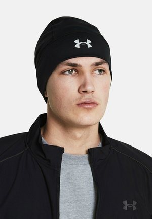 Black fitted beanie made of stretchy material, featuring contrasting white logo at the front, designed for warmth and athletic activity.