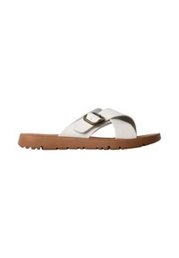 Sandale à semelle marron avec des brides blanches croisées et une boucle en laiton ajustable sur fond blanc.