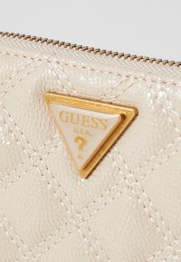 Guess GIULLY beżowy