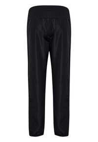 Zwarte sportbroek van een gladde, lichte stof, met een elastische tailleband en een tapering ontwerp bij de enkels. Geen zakken of zichtbare branding.