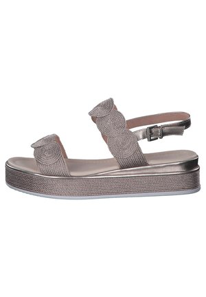 Platform sandals with a metallic bronze finish, featuring textured fabric straps with circular accents and an adjustable buckle closure.