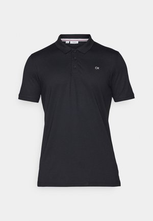Črna bombažna polo majica z dvema gumboma in kratkimi rokavi. Na levi strani prsnega dela ima izvezeno logo "CK".