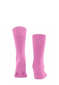 Calze rosa lunghe fino al ginocchio, realizzate in materiale morbido e elastico, con un bordo a costine e una texture liscia; presenta un dettaglio con logo vicino alla caviglia.