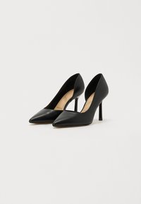 Black leather high heel shoes with a pointed toe, slim stiletto heel, and open sides. Smooth texture and minimal hardware visible.