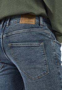 Redefined Rebel STOCKHOLM DESTROY - Slim fit jeans - blue denim