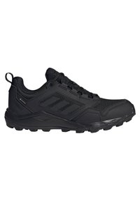 Scarpe da ginnastica nere con tomaia testurizzata, pannelli in rete e suola in gomma rinforzata. Presentano un design con lacci e tallone rinforzato.
