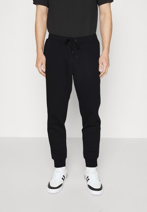 JOGGERPANT - Tracksuit bottoms - black