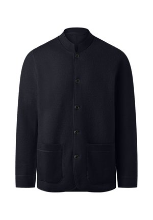 Musta pitkähihaine nappimekko, jossa on ribbikaulus ja kaksi etupussitaskua, esiteltynä valkoista taustaa vasten.