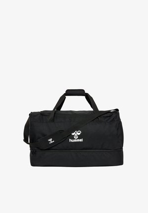 Zwarte Hummel sporttas met dubbele handgrepen, verstelbare schouderriem en een ritsvak aan de onderkant.
