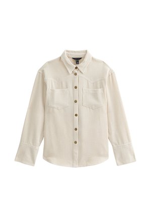 Light beige corduroy shirt with a button-up front, two chest pockets, and a classic collar. Features a textured, ribbed pattern.