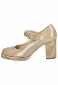 Scarpa Mary Jane in vernice beige con punta rotonda, cinturino alla caviglia e tacco a blocco testurizzato con scanalature orizzontali.