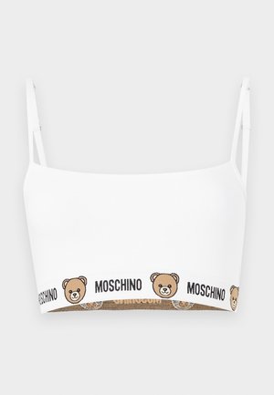 Fehér crop top vékony pántokkal, barna mackóval és a "MOSCHINO" szöveggel, amely ismétlődik az alsó szegélyen.