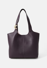 Purple leather tote bag with a textured finish, featuring a wide strap and gold-tone hardware. Open top design with minimalist shape.