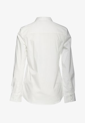 Chemise blanche en coton à manches longues avec un col classique, couture de dos et poignets boutonnés, présentant une texture lisse et propre.