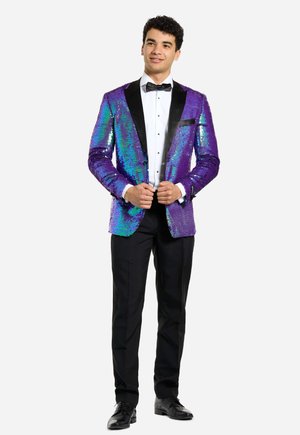 Purple sequin blazer with iridescent sparkle and black satin lapels, paired with a white shirt and black bow tie, black trousers, and shoes.