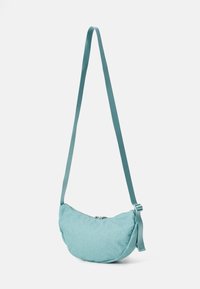 Teal woven shoulder bag with a curved shape. Features a zip closure and a flat, adjustable strap for carrying convenience.