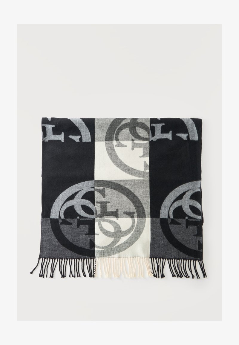 Écharpe à carreaux noir, gris et blanc avec de grands motifs circulaires de logos et des bords frangés, étalée à plat sur une surface blanche.