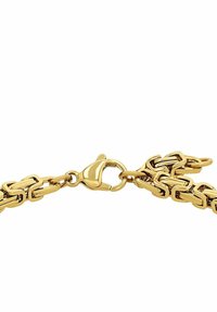 Złota bransoletka łańcuszkowa z przeplatanymi prostokątnymi ogniwami oraz zatrzaskiem w kształcie sprężynki. Gładkie, błyszczące wykończenie o jednolitym kolorze.