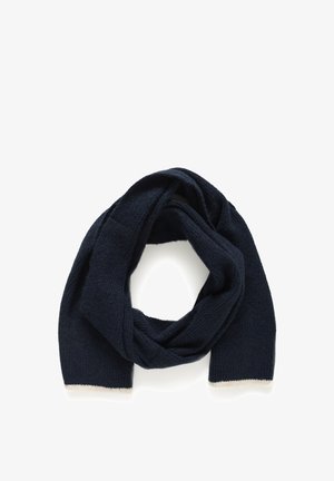 Écharpe tricotée bleu marine avec une finition texturée et des bordures crème, formant une forme circulaire lâche.