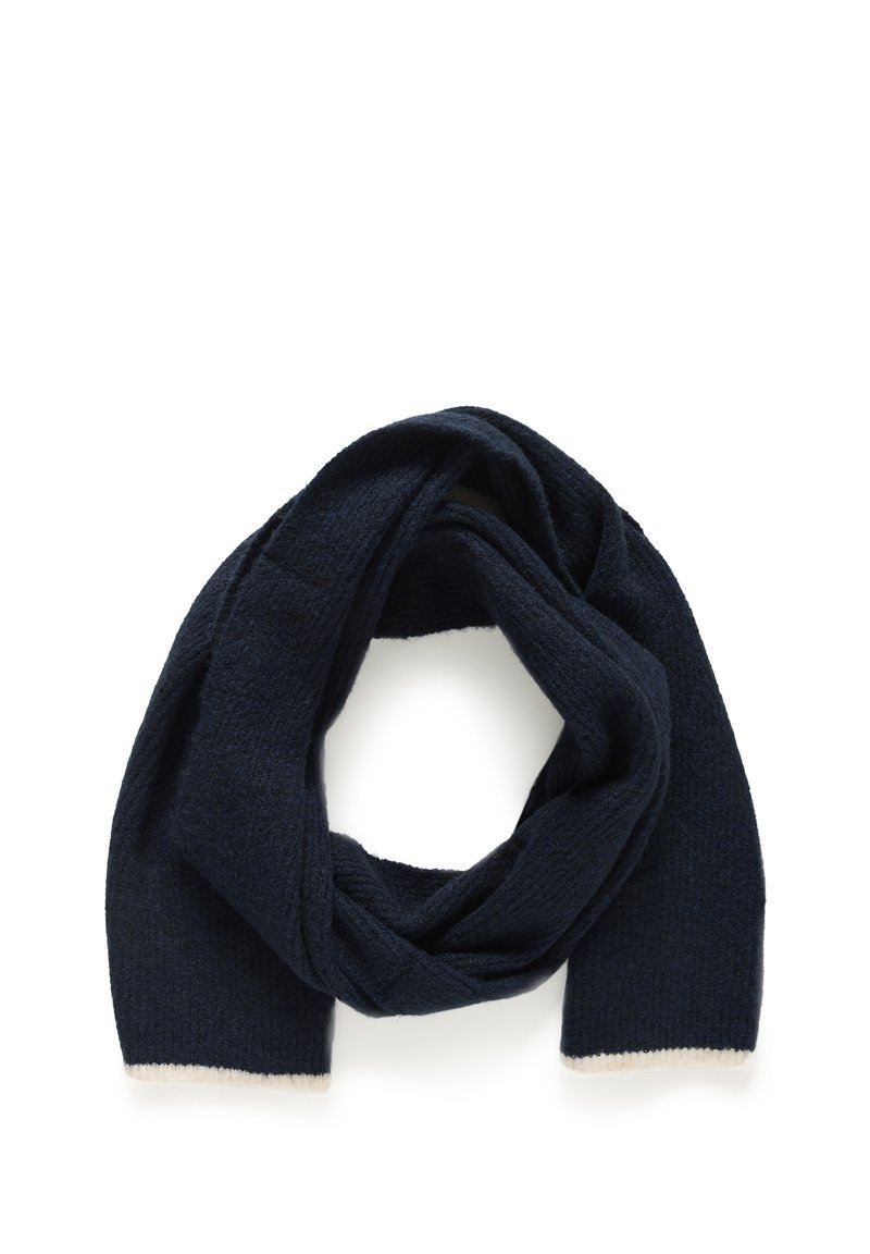 Navy knitted scarf with a textured finish and cream-colored trim at the edges, forming a loose, circular shape.