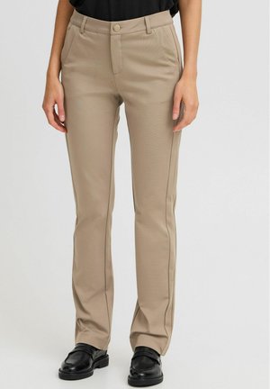 Beige tailored pants made from textured fabric, featuring a straight leg design, side pockets, and a front button closure.