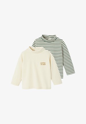 Two long-sleeve turtlenecks: one cream with "winter is cool" text, the other green and white striped. Soft material, relaxed fit, button closure.