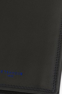 Black leather wallet with a textured surface, featuring blue stitching and embossed logo detail. Compact and rectangular design.