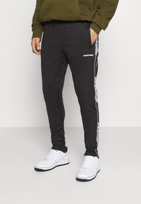 Pegador Träningsbyxor - black